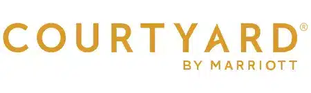 Courtyard by Marriott logo in gold lettering on a white background. (Brand logo)